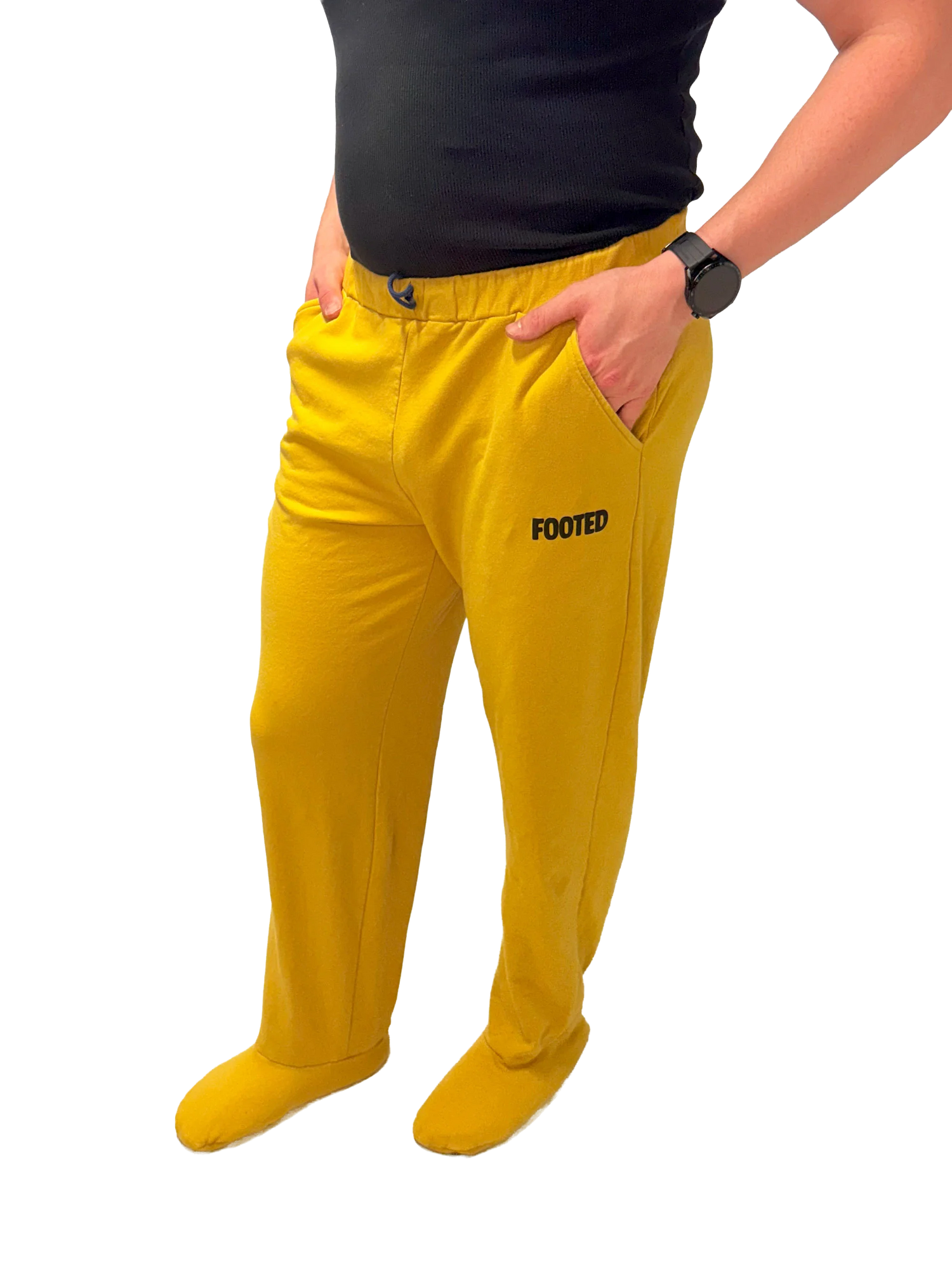 Yellow FOOTED pants with footed design, shown on model against transparent background.